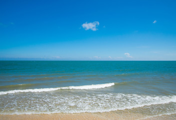 Fototapeta na wymiar Turquoise sea wave on the empty sea beach blue sky sand sun daylight.