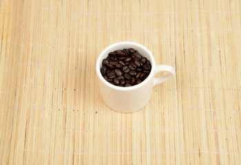  coffee beans in cup 