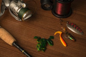 Predator fishing tools on the wooden background