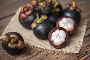 Mangosteen fruit on wooden background