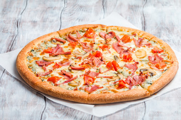 Delicious pizza with mushrooms and ham