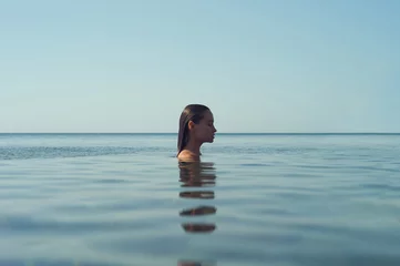 Beautiful elegant woman in the sea © Egor Mayer