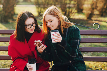 Two girls with gadget