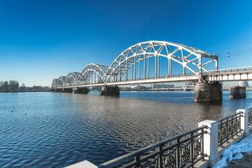 Fototapeta premium A view of the Railway Bridge over Daugava River in Riga, Latvia