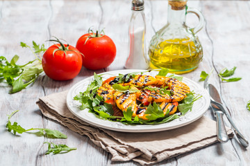 Delicious grilled pumpkin and arugula  salad 