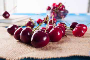 Cherry isolated on wood desk.