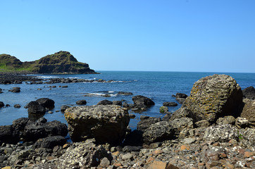 Fototapeta na wymiar rocky coast with many rocks in Ireland with blue sky