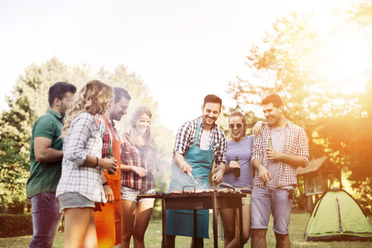 Friends camping and having a barbecue