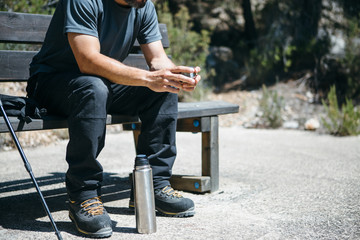 Traveler with flask on bench