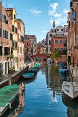 Street scene with canal in Venice, Italy
