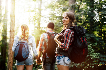 Fototapeta premium Group of people hiking in forest
