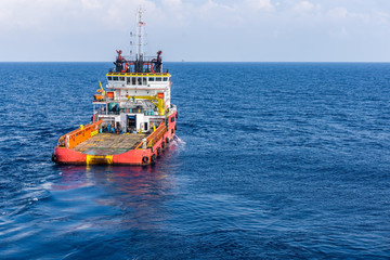 Anchor handling tug in the open sea at oilfield