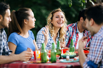 Friends eating outdoors and having fun