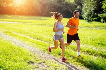 Peel and stick wall murals Jogging Athletic couple jogging in nature