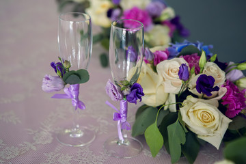 arrangement of different flowers is on the table