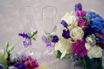 arrangement of different flowers is on the table
