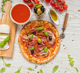 Delicious pizza served on wooden table
