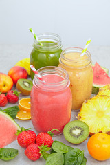 Fruits, berries and jars of fresh smoothie