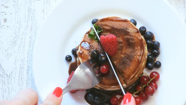 Delicious pancakes on wooden table with fruits