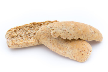 Dry flat bread crisps with herbs on a white background.