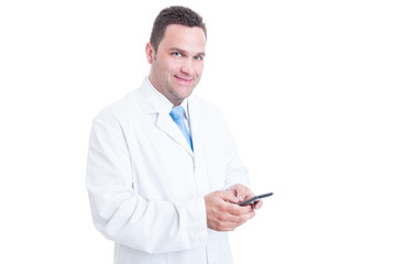 Male medic or manager texting and looking at camera
