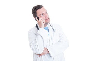 Male doctor speaking at phone offering support or advice