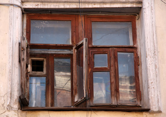 Old house with an antique wooden window
