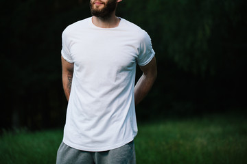 Hipster man wearing white blank t-shirt with space for your logo