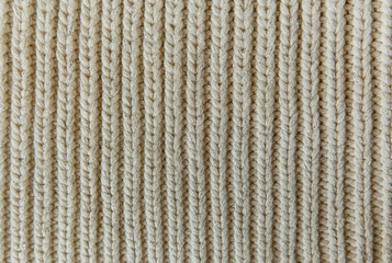 The Knitting Background with White Stitch.Handmade Texture.