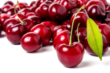red cherry with leaf isolated on white background