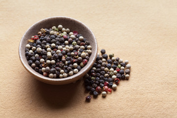 Mix of peppers; red pepper, black pepper, white pepper and green