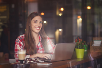 Freelance lady working in cafe