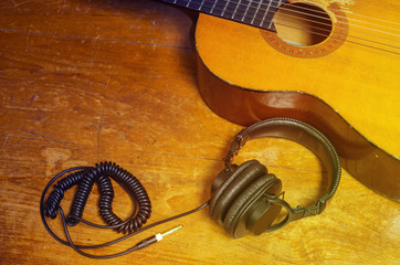 Acoustic guitar and headphone.