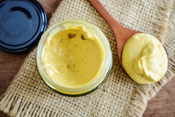 Mustard sauce on rustic wooden table