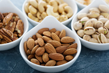 Variety of nuts in small bowls