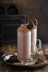 Chocolate cookie milkshake in tall mugs