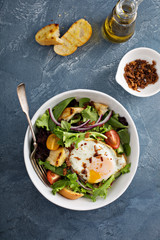 Breakfast salad with eggs and bacon