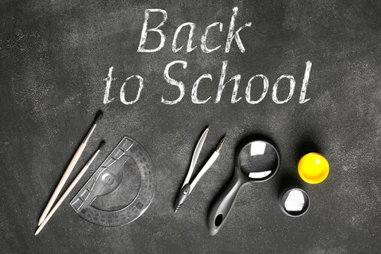 School accessories on the black chalkboard