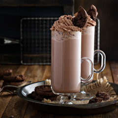 Chocolate cookie milkshake in tall mugs