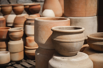 Huge roasted ceramimc pots without glaze storage