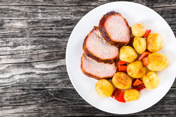 new potatoes Baked with  pork tenderloin  in a baking dish
