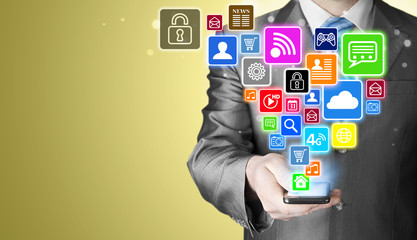 Business man using smart phone with social media icon set