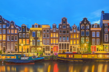 Fototapeta premium Amstel river, canals and night view of beautiful Amsterdam city. Netherlands.