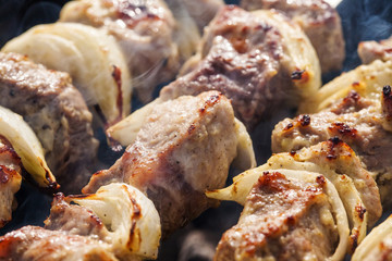 Barbecue skewers with grilled pork meat on the brazier