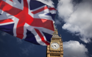Fototapeta na wymiar British union jack flag and Big Ben Clock Tower at city of westminster in the background - UK votes to leave the EU
