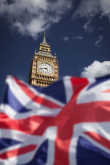 Fototapeta na wymiar British union jack flag and Big Ben Clock Tower at city of westminster in the background - UK votes to leave the EU