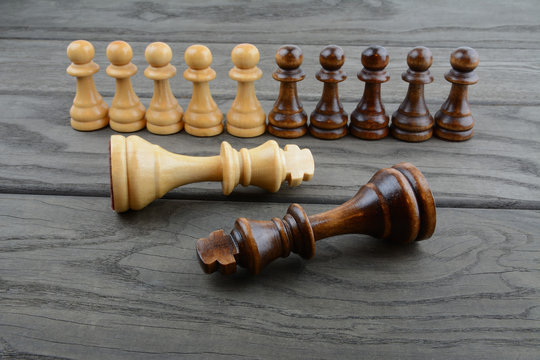 Chess pieces on wooden surface