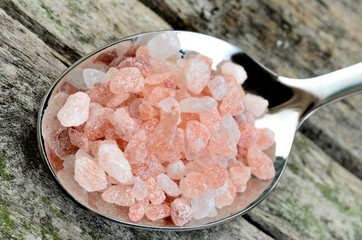 Pink salt in spoon