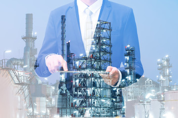 Double exposure of businessman hand hold tablet