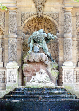 Color DSLR stock image of the Medicis Fountain in Luxembourg Gardens, Paris, France, erected in 1861. The Left Bank, Latin Quarter landmark is popular with tourists and locals. Vertical. 